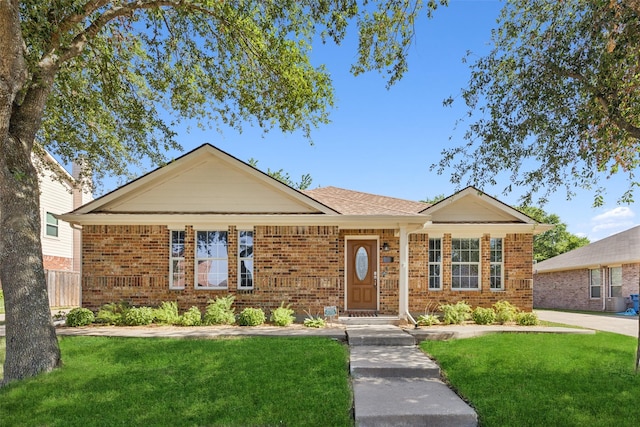 ranch-style house featuring a front lawn