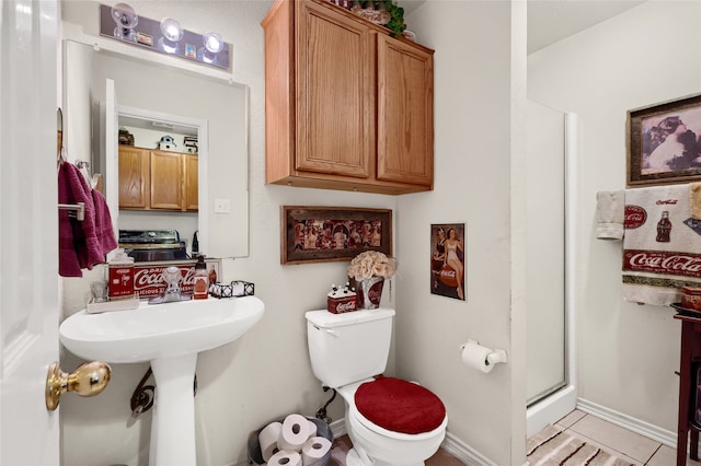 bathroom with walk in shower, tile patterned floors, and toilet