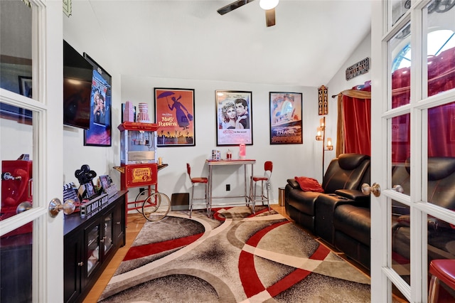 living room featuring wood-type flooring, french doors, vaulted ceiling, and ceiling fan