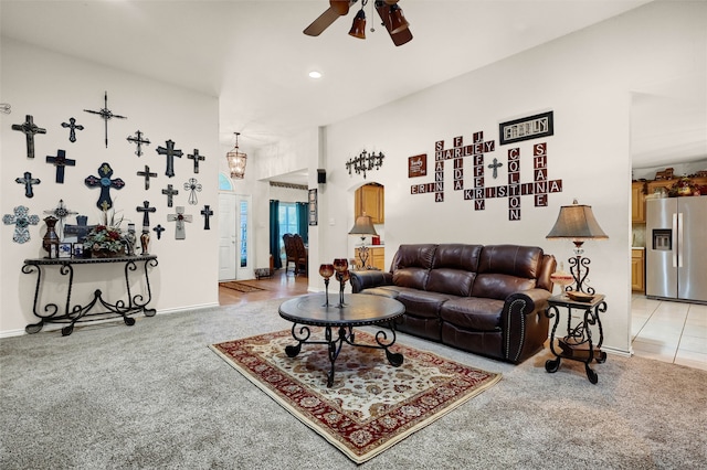 living room featuring carpet floors and ceiling fan