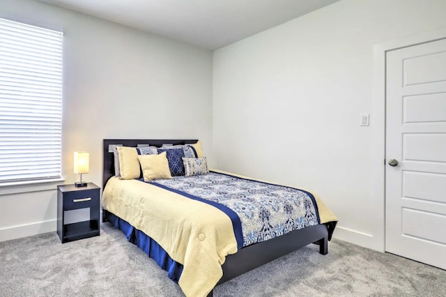 bedroom featuring light colored carpet