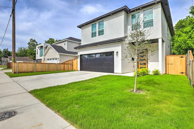 view of front of house with a front lawn and a garage