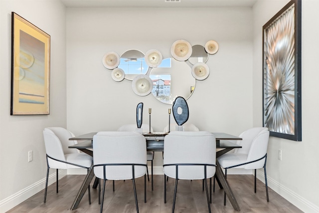 dining area featuring hardwood / wood-style flooring