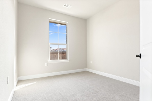 unfurnished room featuring carpet