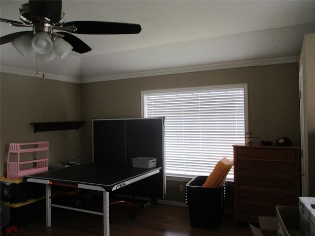 office space featuring ceiling fan, vaulted ceiling, ornamental molding, and hardwood / wood-style flooring