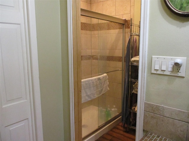 bathroom with a shower with shower door