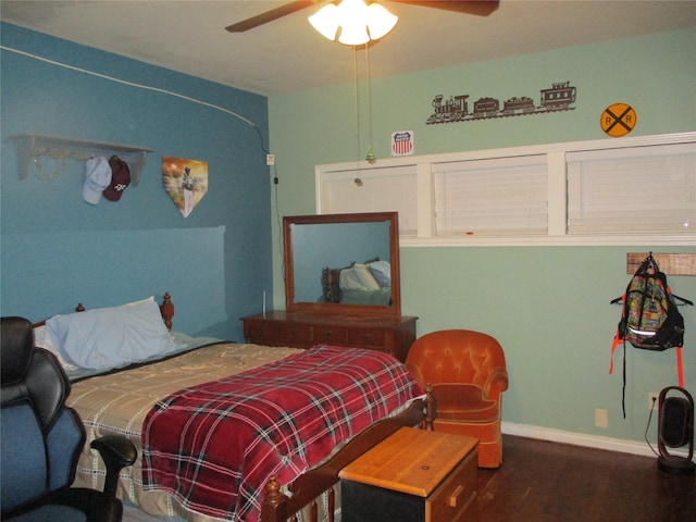 bedroom featuring ceiling fan and dark hardwood / wood-style flooring