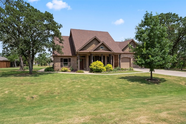 craftsman house with a garage and a front yard