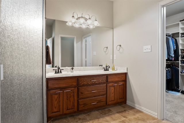 bathroom featuring dual bowl vanity and tile patterned floors