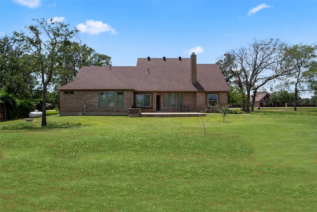 rear view of house with a lawn