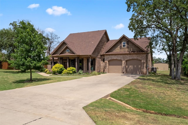 craftsman inspired home featuring a garage and a front yard