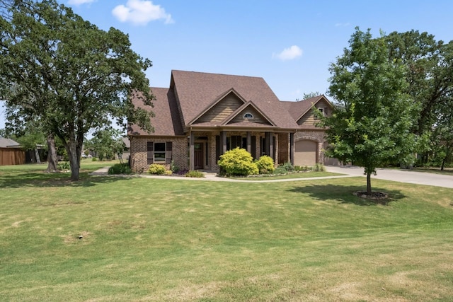 craftsman inspired home featuring a garage and a front yard