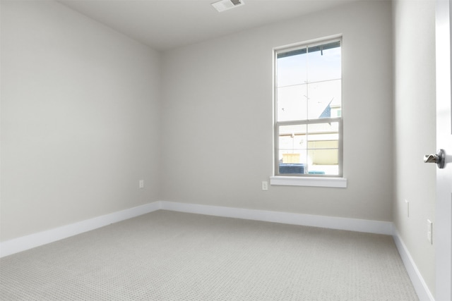 carpeted empty room featuring a healthy amount of sunlight