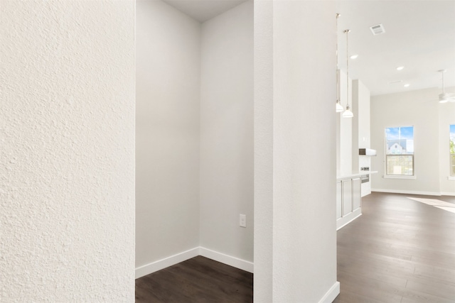 hall with dark hardwood / wood-style flooring