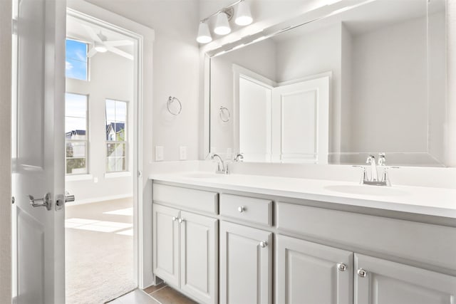 bathroom featuring a sink and double vanity