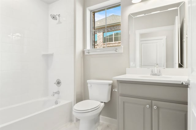 full bathroom featuring vanity, tiled shower / bath combo, and toilet