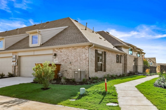 view of home's exterior with a yard and a garage