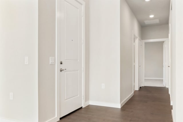 hallway with baseboards, recessed lighting, and wood finished floors