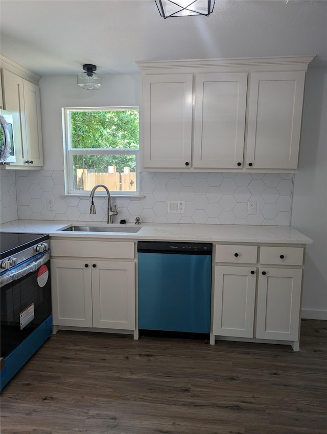 kitchen with decorative backsplash, white cabinetry, sink, and stainless steel appliances