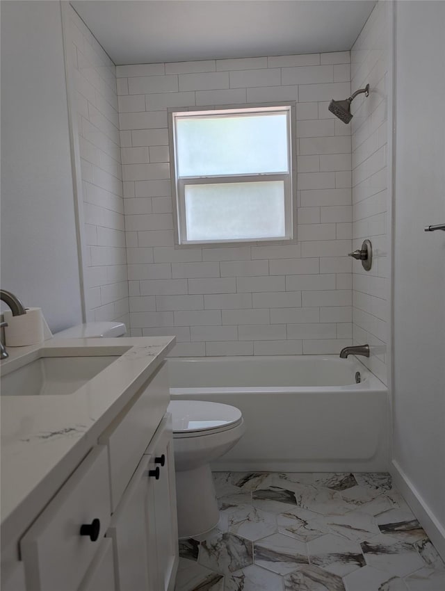 full bathroom featuring vanity, toilet, and tiled shower / bath