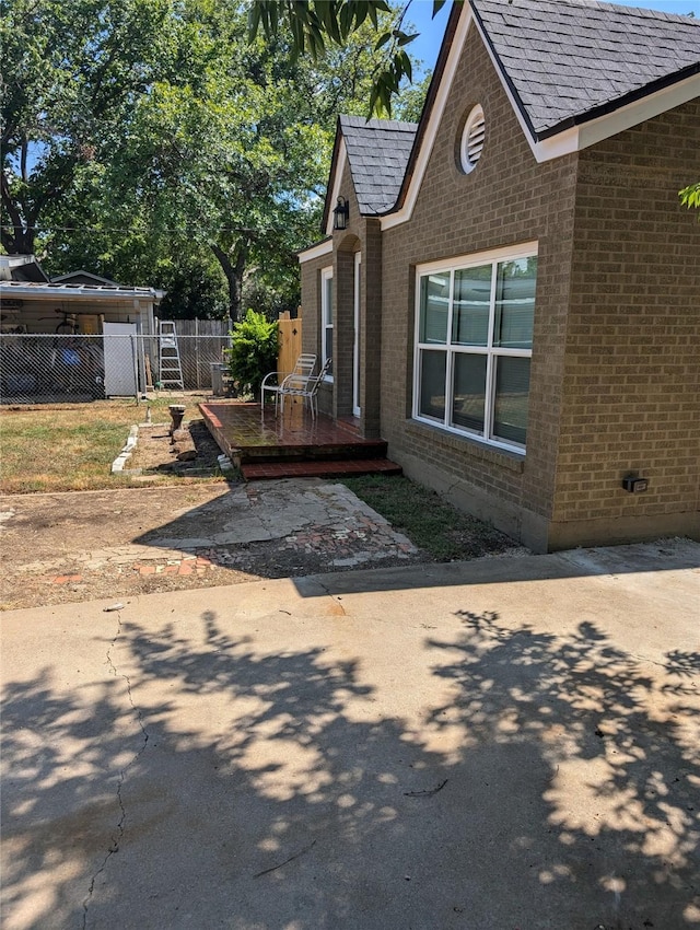 view of side of property with a patio area