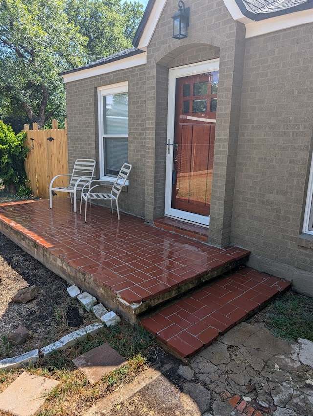 entrance to property with a patio