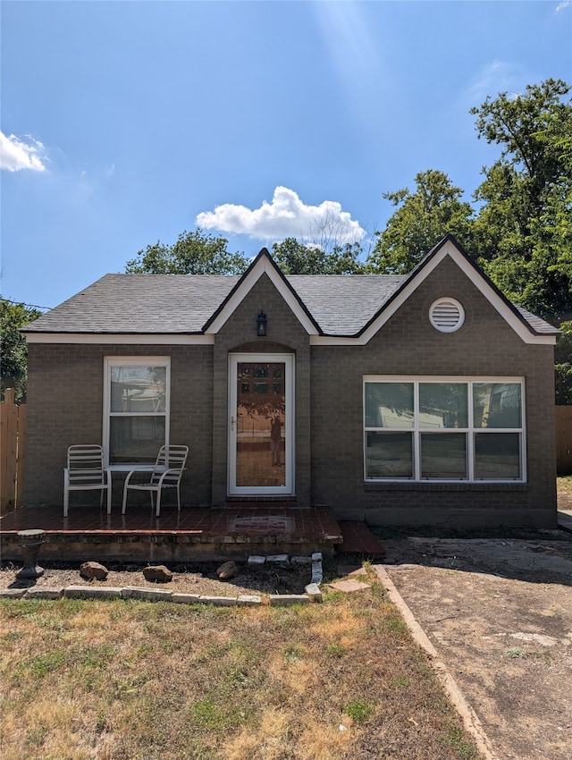 view of front of home with a front lawn and a porch