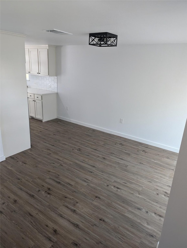 interior space with dark hardwood / wood-style flooring