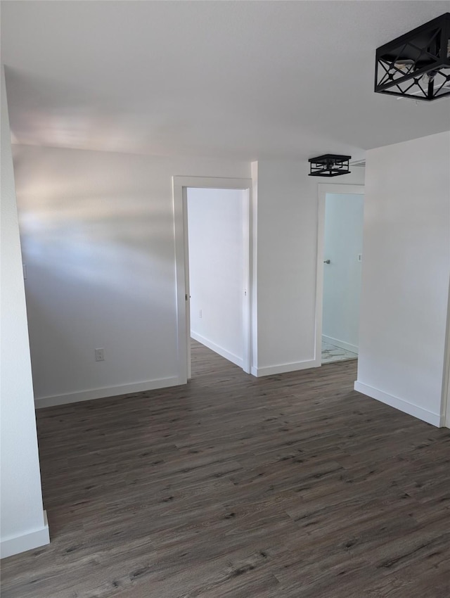 unfurnished room featuring dark hardwood / wood-style floors