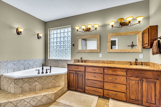 bathroom with vanity and tiled bath