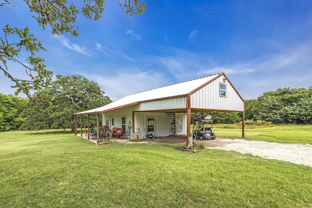 exterior space featuring an outbuilding and a yard