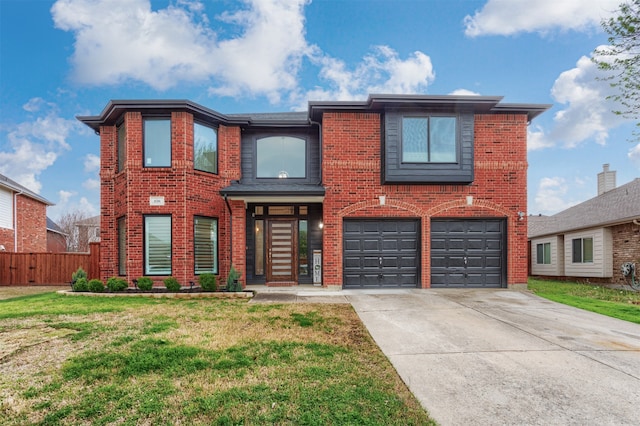 view of front of home featuring a garage and a front yard