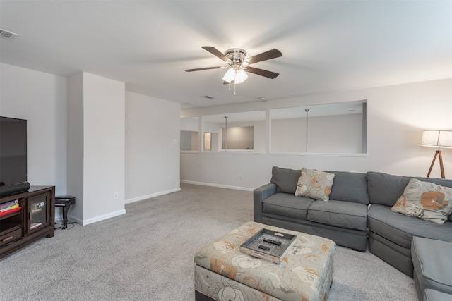 living room featuring light carpet and ceiling fan