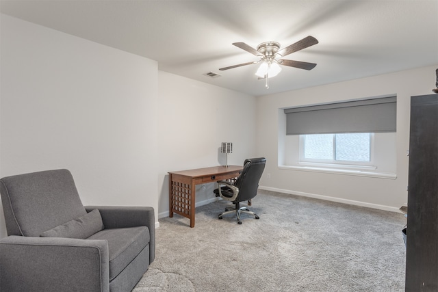 carpeted office with ceiling fan