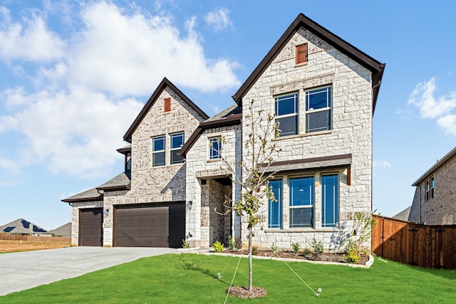 view of front of house with a garage and a front yard