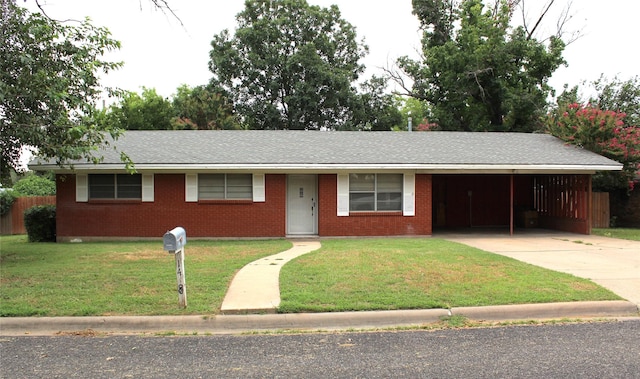 single story home with a front yard and a carport