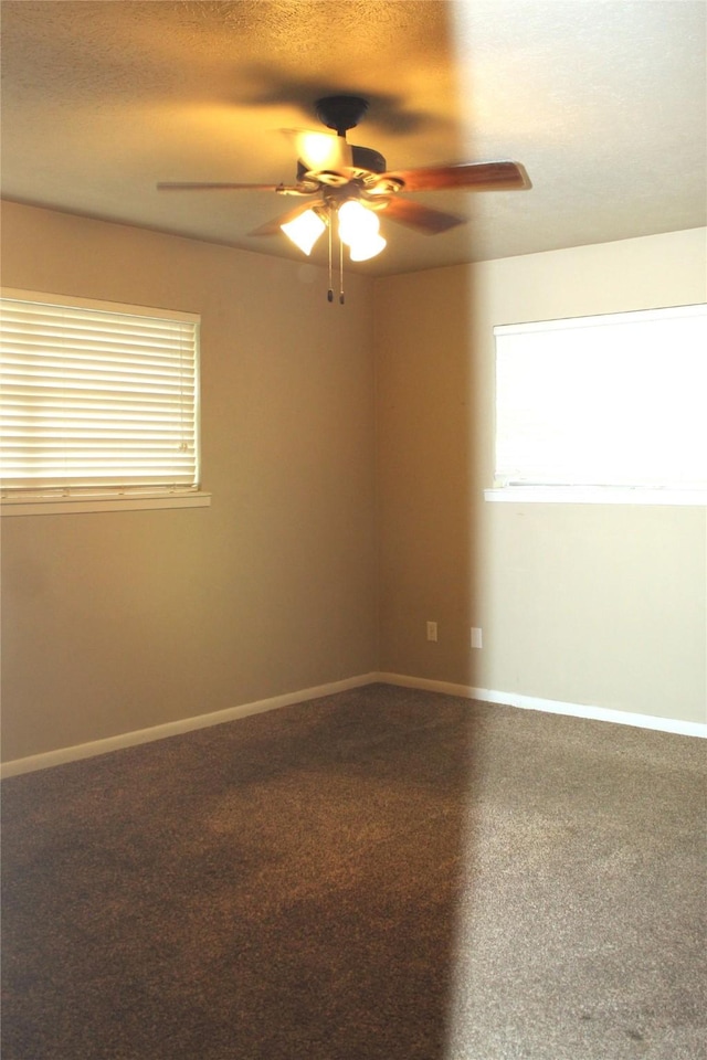 spare room with ceiling fan