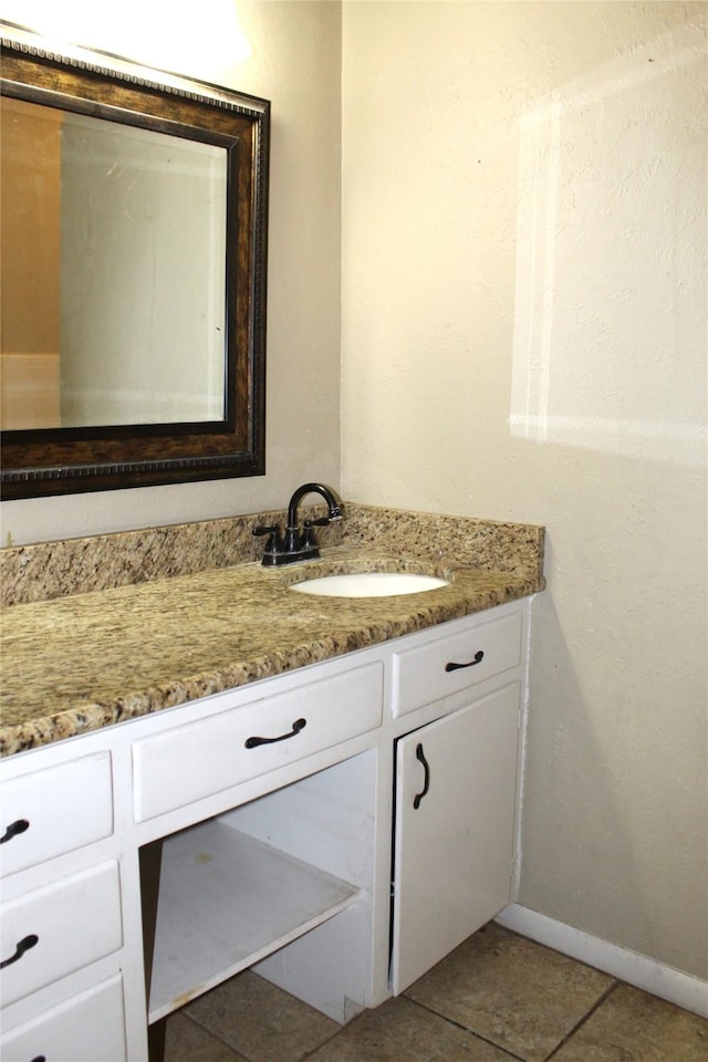 bathroom with vanity and tile patterned floors