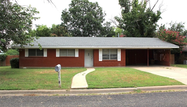 single story home featuring a carport and a front yard