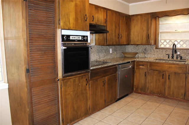 kitchen featuring wall oven, black electric stovetop, light stone countertops, stainless steel dishwasher, and sink