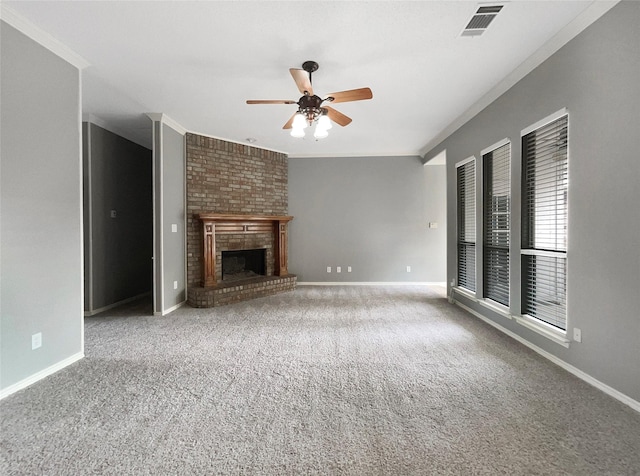 unfurnished living room featuring a brick fireplace, ceiling fan, carpet, and ornamental molding