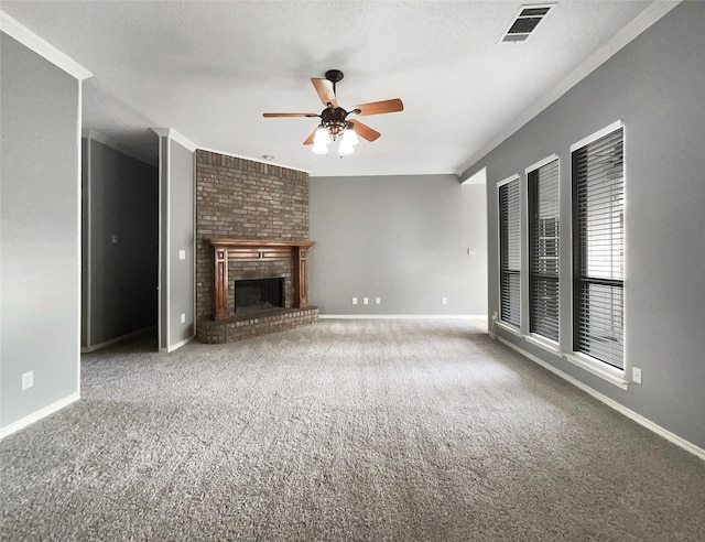 unfurnished living room with carpet flooring, ceiling fan, a textured ceiling, and a brick fireplace