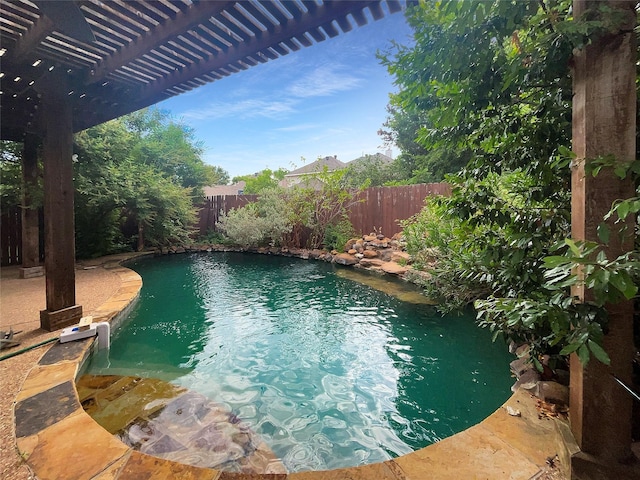 view of swimming pool with a pergola