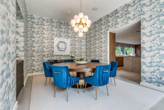 dining area featuring a notable chandelier