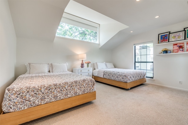 carpeted bedroom featuring lofted ceiling