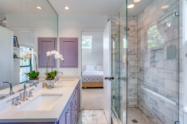 bathroom with a shower with door, tile patterned flooring, and double sink vanity