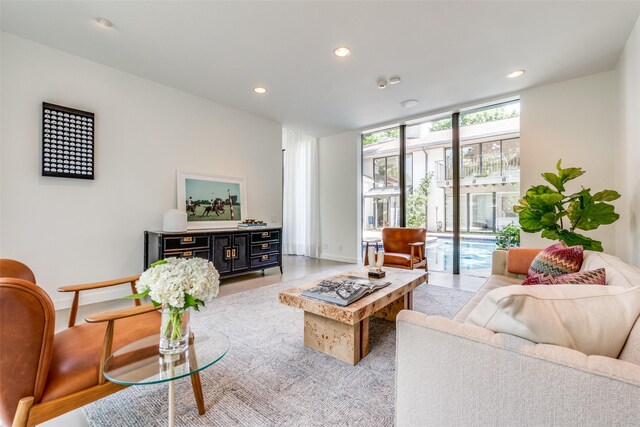 living room featuring a wall of windows