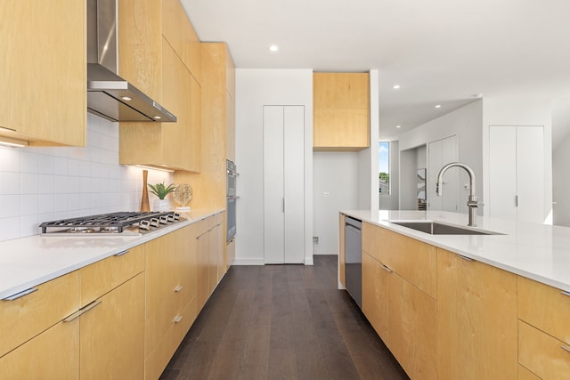 kitchen with light brown cabinetry, tasteful backsplash, dark hardwood / wood-style floors, and wall chimney exhaust hood