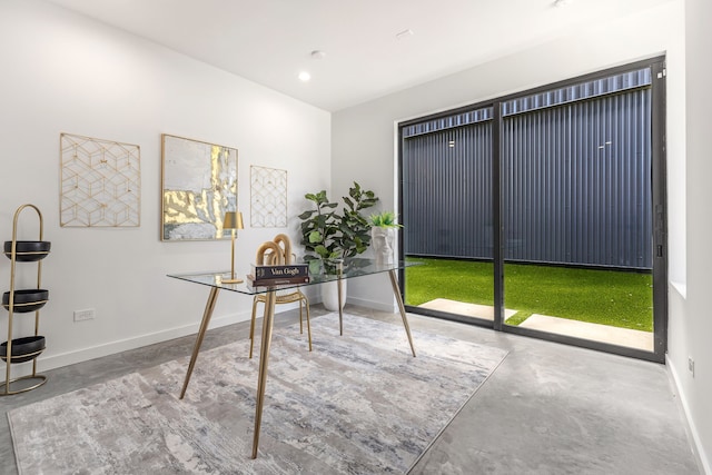 home office featuring concrete floors