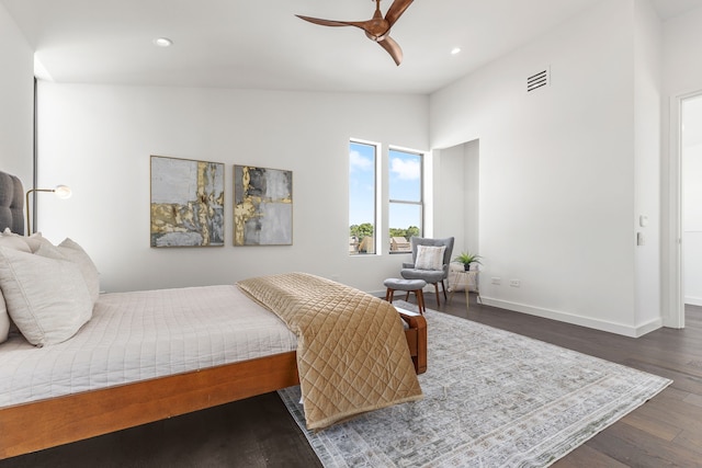 bedroom with lofted ceiling, dark hardwood / wood-style flooring, and ceiling fan